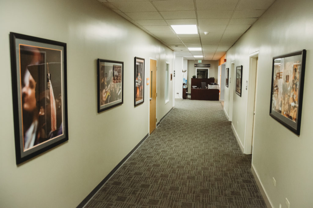 Hallway from east entrance with UT pictures on the wall.