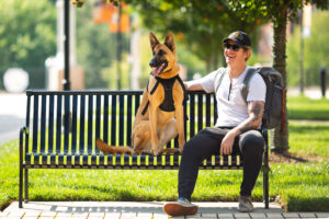 A Marine veteran and service dog hang out in the Student Union Plaza.